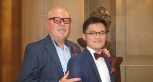 Randy Shields stands with his husband, Harrison Yeo, on their wedding day