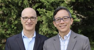 Mike Tekulsky (left) and Ron Wong (right) stand in front of a tree