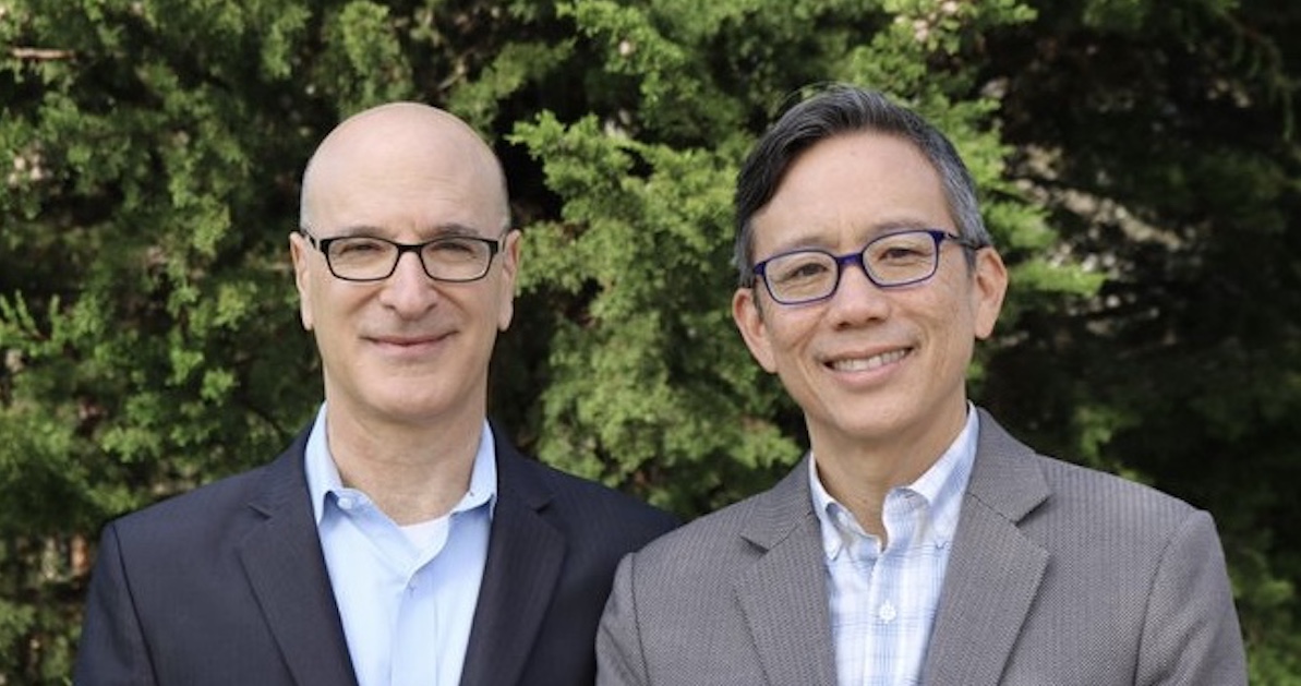 Mike Tekulsky (left) and Ron Wong (right) stand in front of a tree