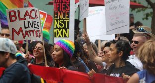 Photo of Black Lives Matter march with Pride flag